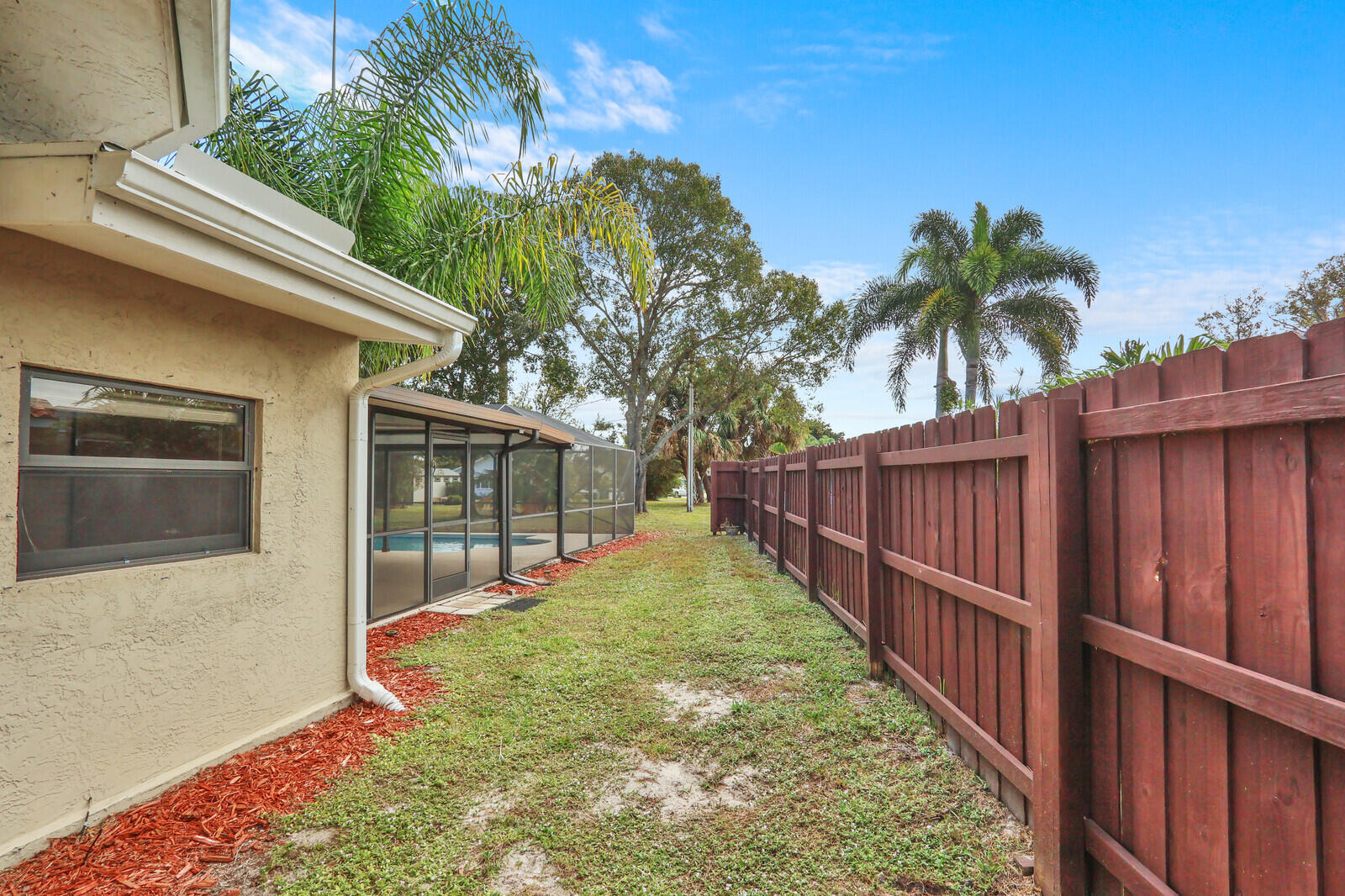 3060 Southeast Darien Road Port St. Lucie, FL 34952 - Photo 44 of 56 a view of a backyard with plants