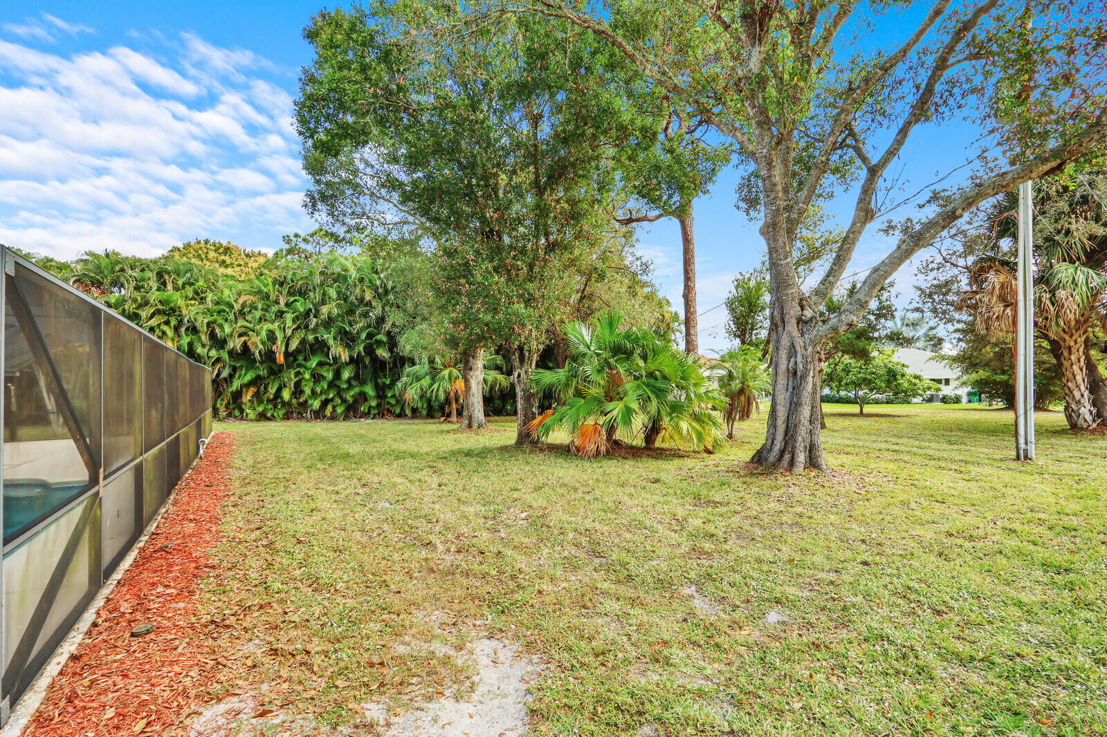 3060 Southeast Darien Road Port St. Lucie, FL 34952 - Photo 45 of 56 a view of a yard with basketball court