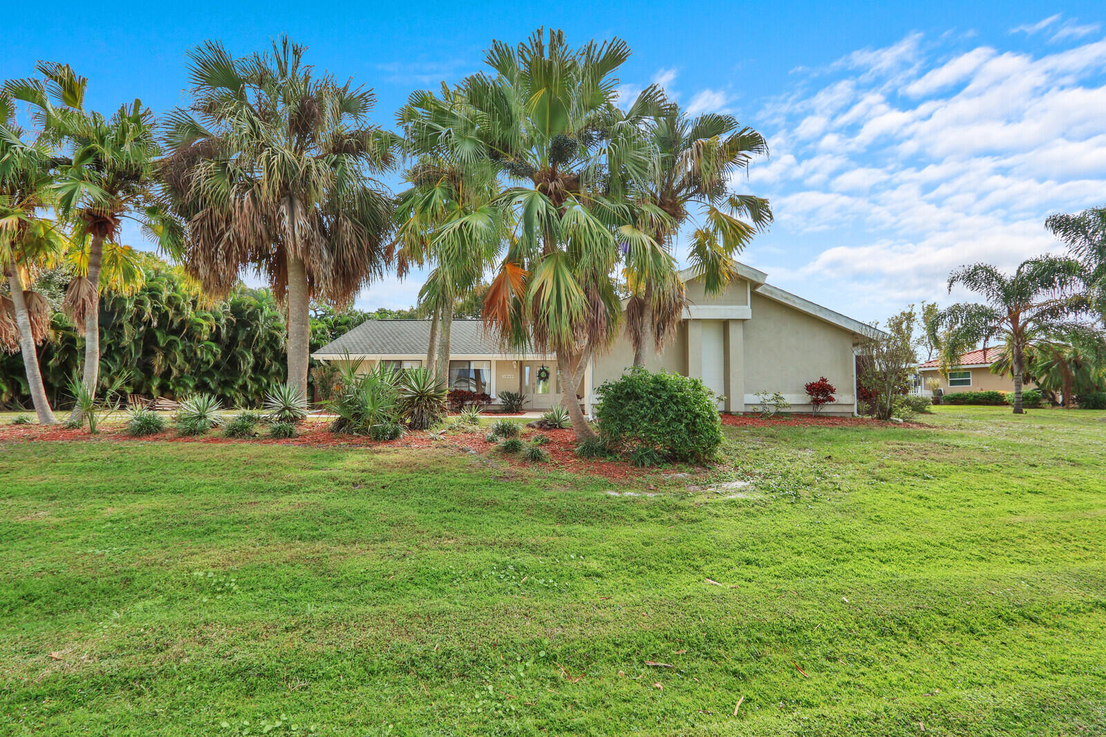 3060 Southeast Darien Road Port St. Lucie, FL 34952 - Photo 55 of 56 a front view of house with yard and green space