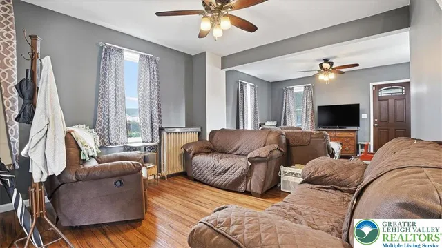 a living room with furniture and a flat screen tv