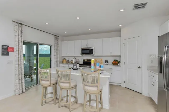 a living room with fireplace furniture and a flat screen tv