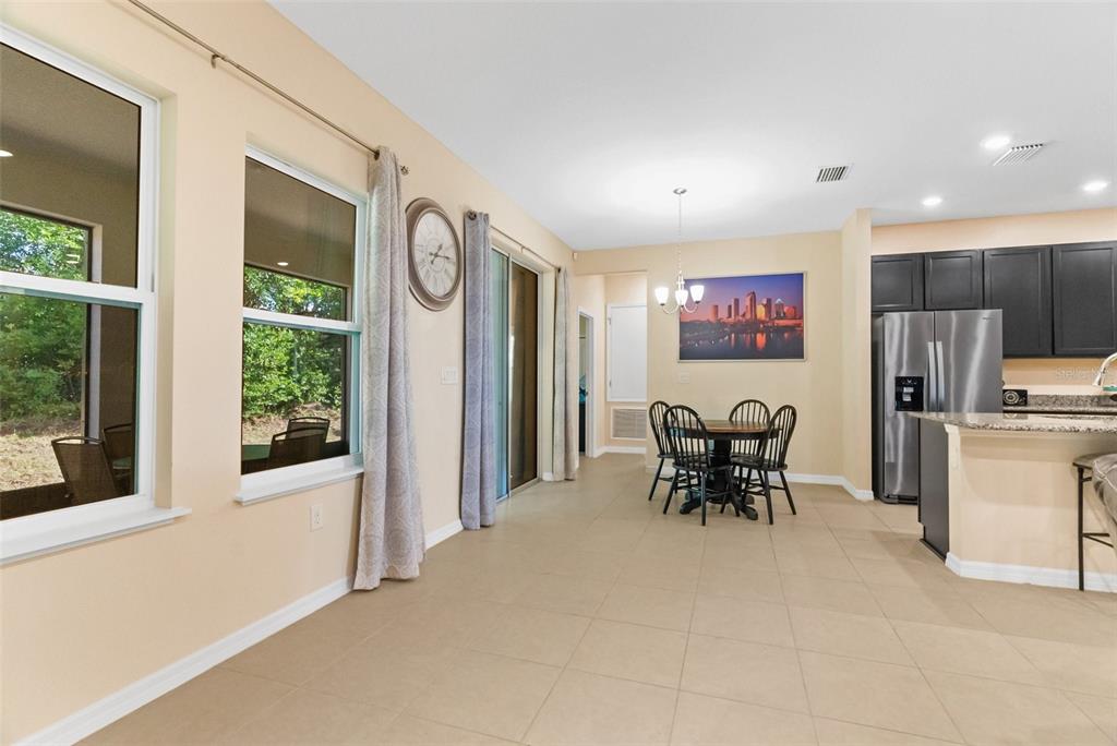 6283 Grapewood Road Spring Hill, FL 34609 - Photo 26 of 41 a view of a dining room with furniture window and outside view
