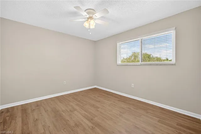 a view of washer and dryer with bathroom in the background