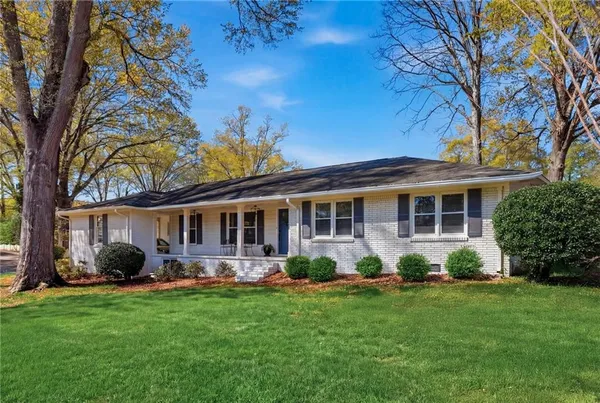 a front view of house with yard and green space