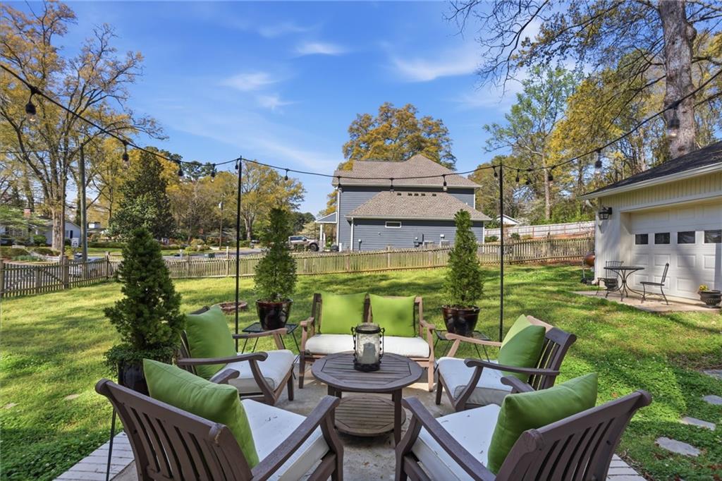 555 Allgood Road Northeast Marietta, GA 30060 - Photo 24 of 32 a view of a patio with couches chairs and a big yard