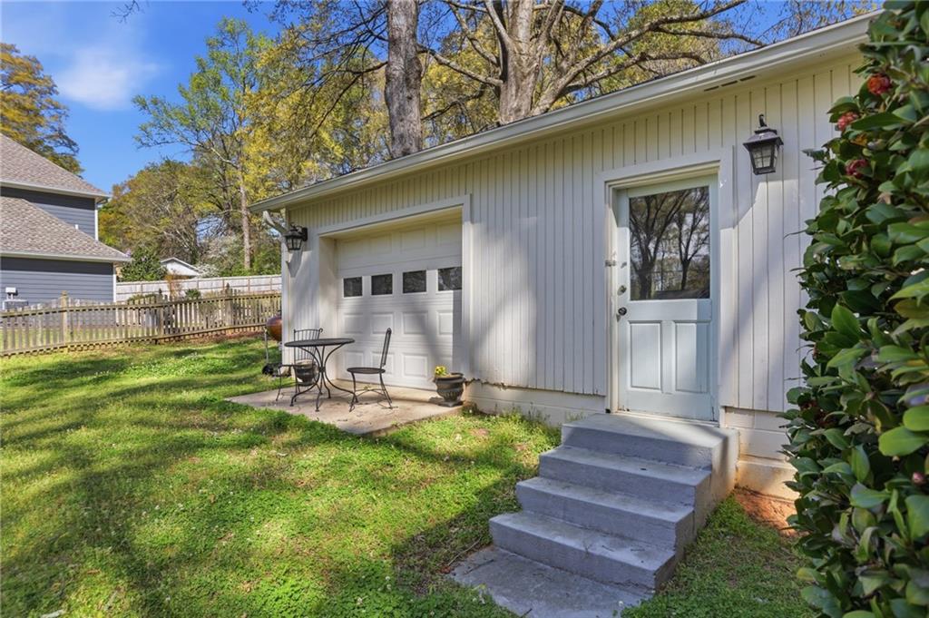 555 Allgood Road Northeast Marietta, GA 30060 - Photo 25 of 32 a front view of a house with garden and sitting area