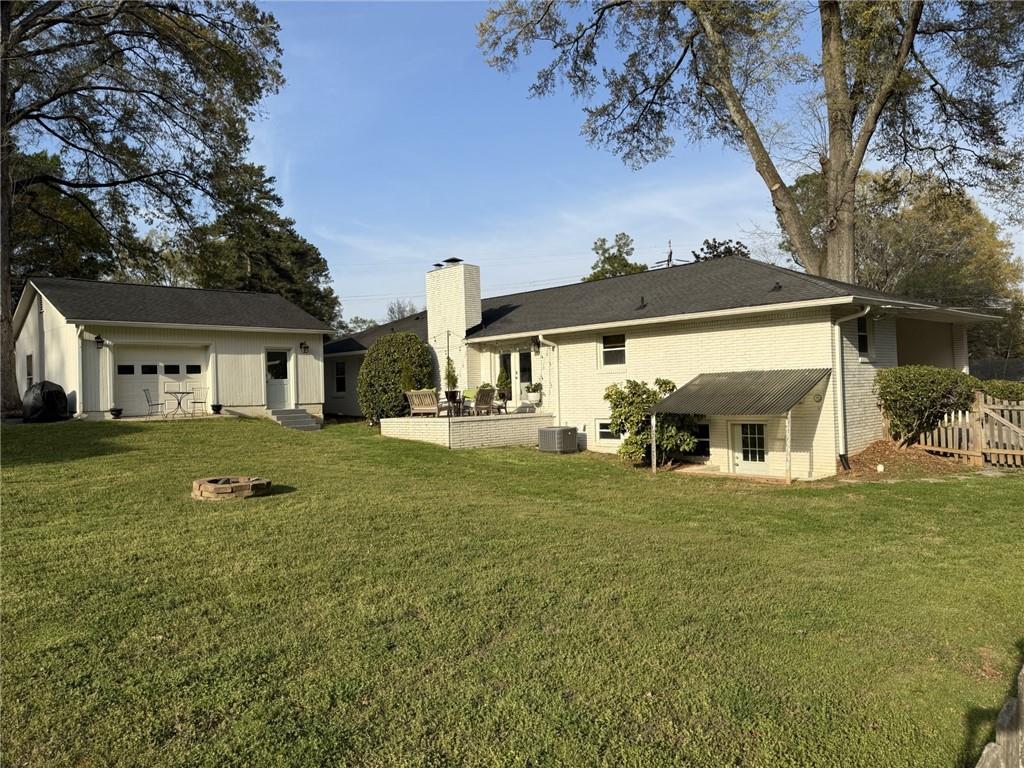 555 Allgood Road Northeast Marietta, GA 30060 - Photo 26 of 32 a front view of a house with a yard