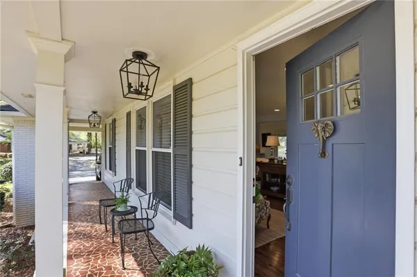 a view of entryway and hall with dining room