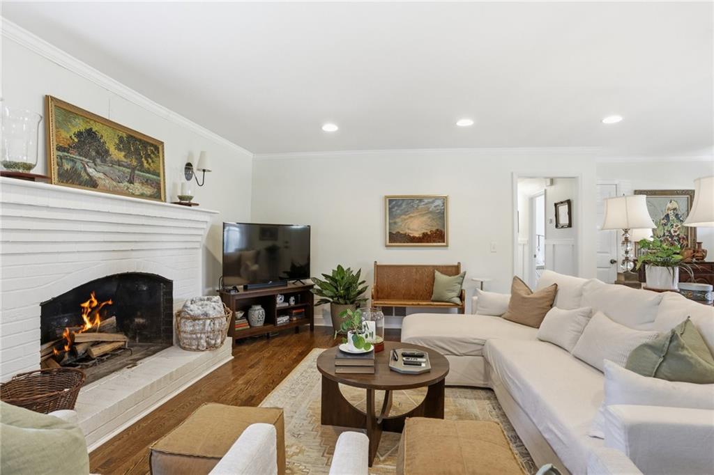 555 Allgood Road Northeast Marietta, GA 30060 - Photo 8 of 32 a living room with furniture and a fireplace