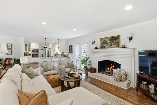 a living room with furniture a fireplace and a fireplace
