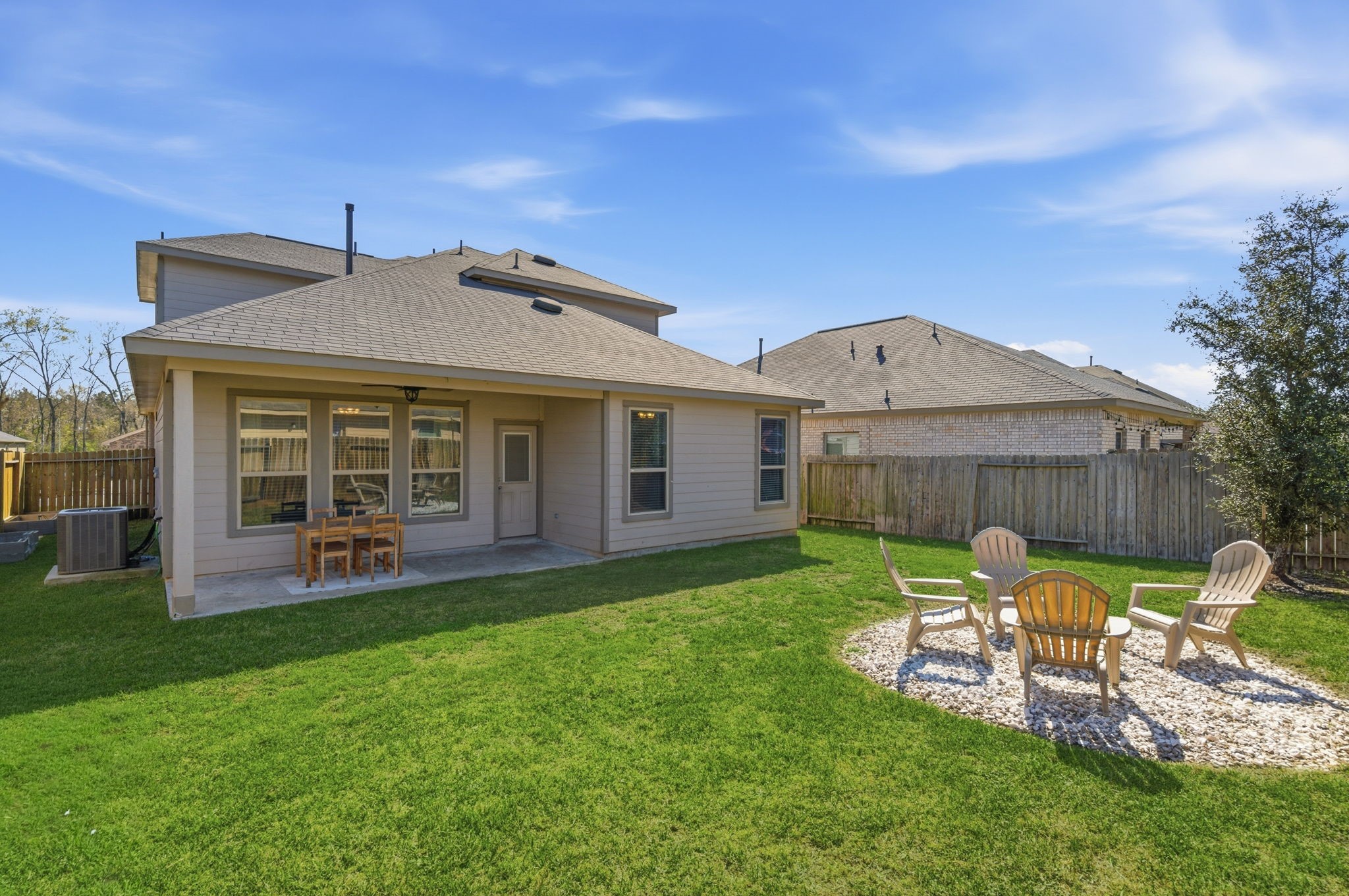 2121 Cedar Way Drive Conroe, TX 77301 - Photo 22 of 27 a view of a house with a yard and sitting area