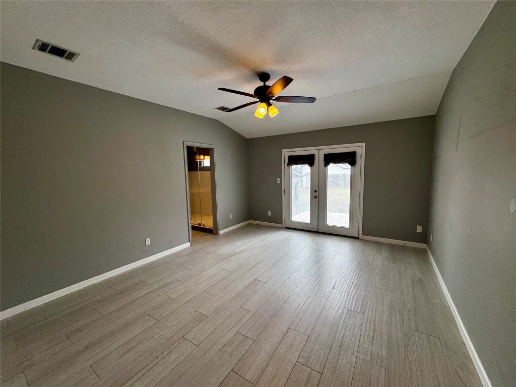 104 Silk Tree Lane Round Rock, TX 78664 - Photo 13 of 29 a view of empty room with wooden floor and fan