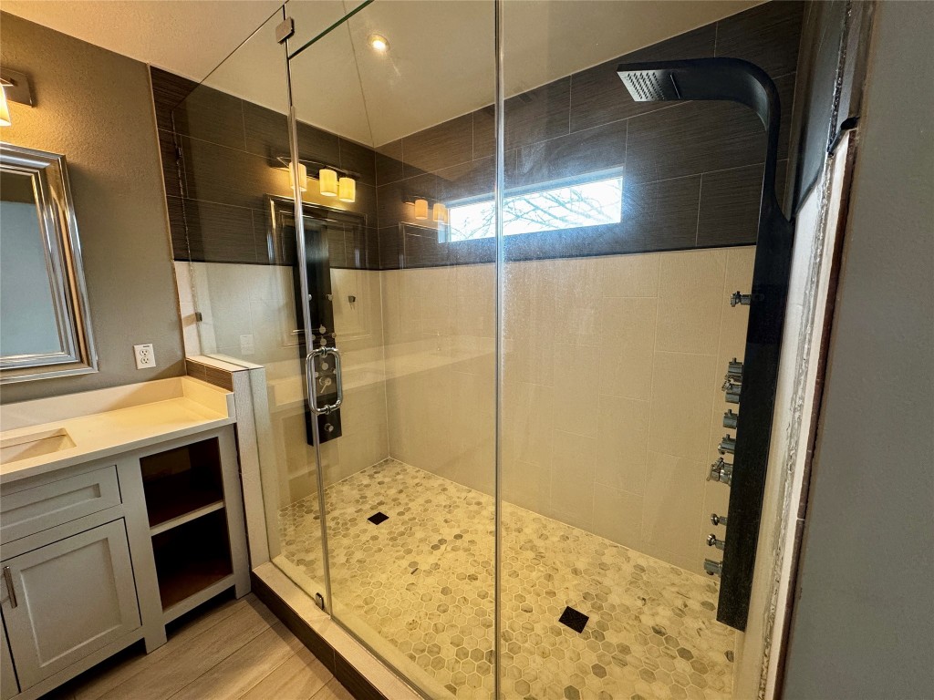 104 Silk Tree Lane Round Rock, TX 78664 - Photo 15 of 29 a bathroom with a shower and a sink