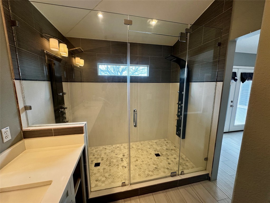 104 Silk Tree Lane Round Rock, TX 78664 - Photo 16 of 29 a bathroom with a shower and a sink