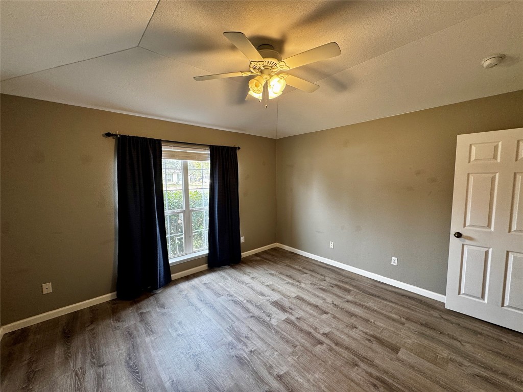 104 Silk Tree Lane Round Rock, TX 78664 - Photo 18 of 29 a view of an empty room with a window