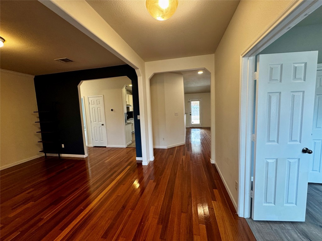 104 Silk Tree Lane Round Rock, TX 78664 - Photo 2 of 29 a view of a hallway with wooden floor