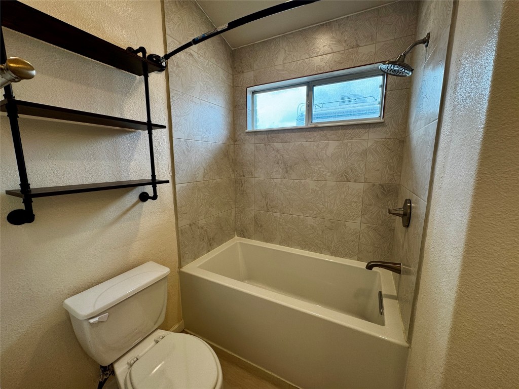104 Silk Tree Lane Round Rock, TX 78664 - Photo 20 of 29 a white toilet sitting next to a bath tub