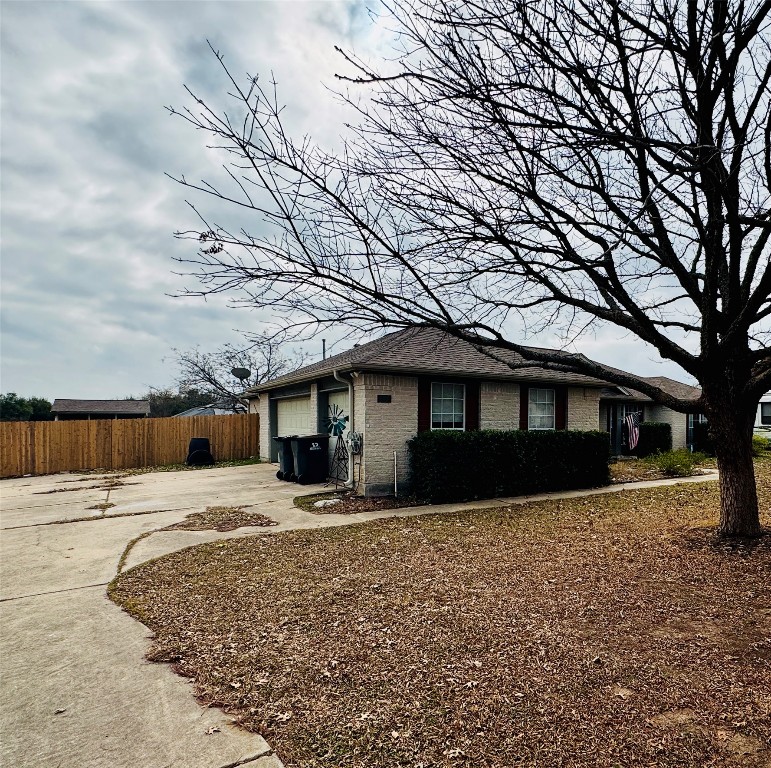 104 Silk Tree Lane Round Rock, TX 78664 - Photo 28 of 29 a front view of a house with a yard