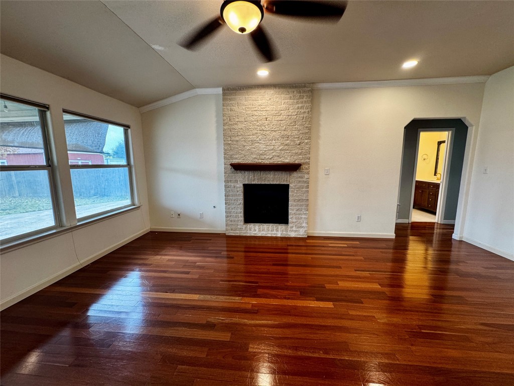 104 Silk Tree Lane Round Rock, TX 78664 - Photo 4 of 29 a view of an empty room with wooden floor and a window