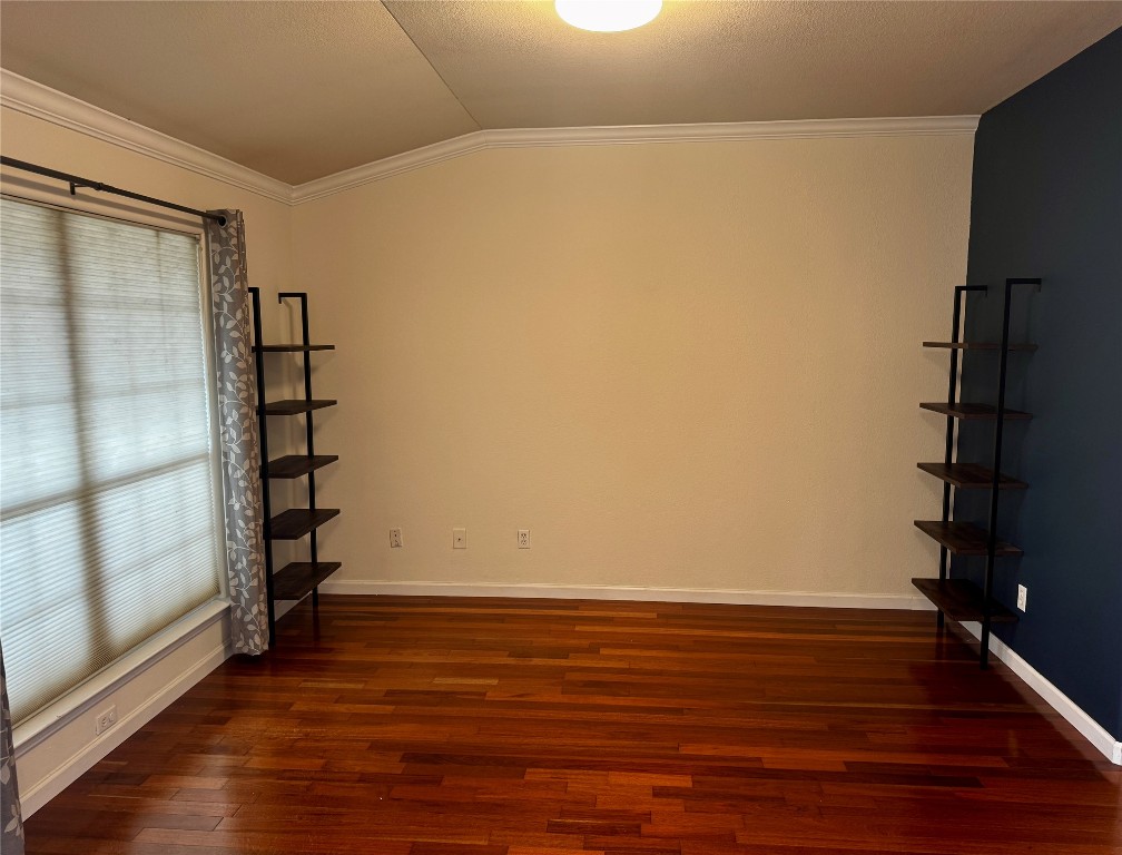 104 Silk Tree Lane Round Rock, TX 78664 - Photo 7 of 29 a view of an empty room with wooden floor and entryway