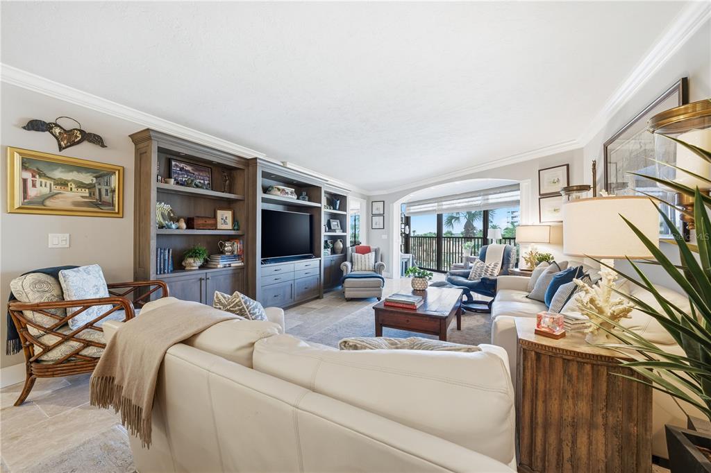 5880 Midnight Pass Road, Unit 302 Sarasota, FL 34242 - Photo 21 of 97 a bed room with a bed and a couch