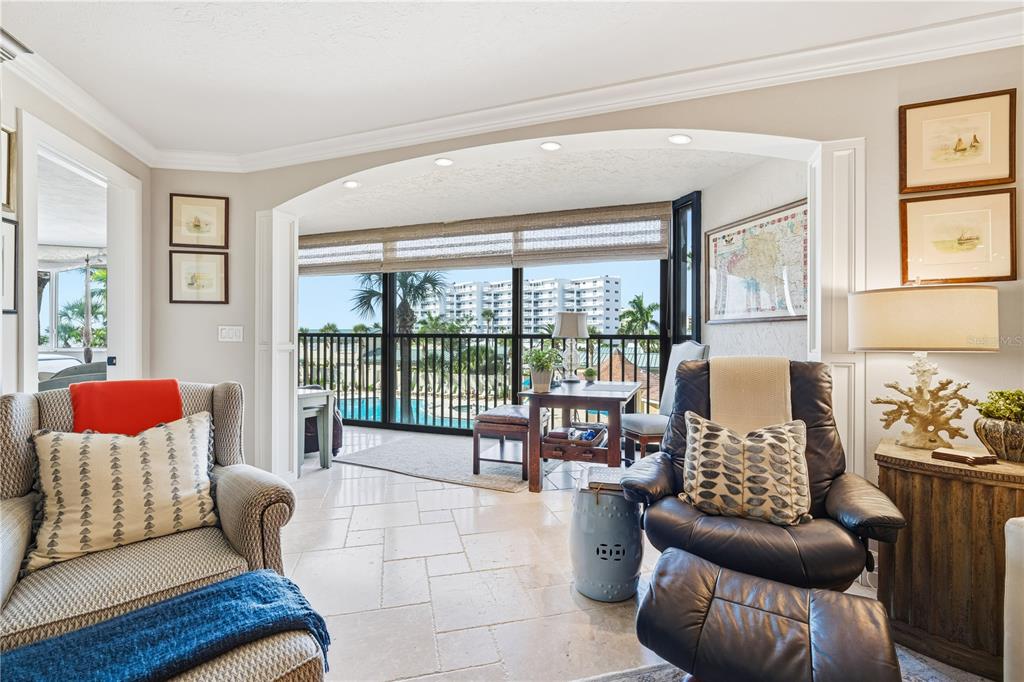 5880 Midnight Pass Road, Unit 302 Sarasota, FL 34242 - Photo 26 of 97 a living room with furniture and a large window