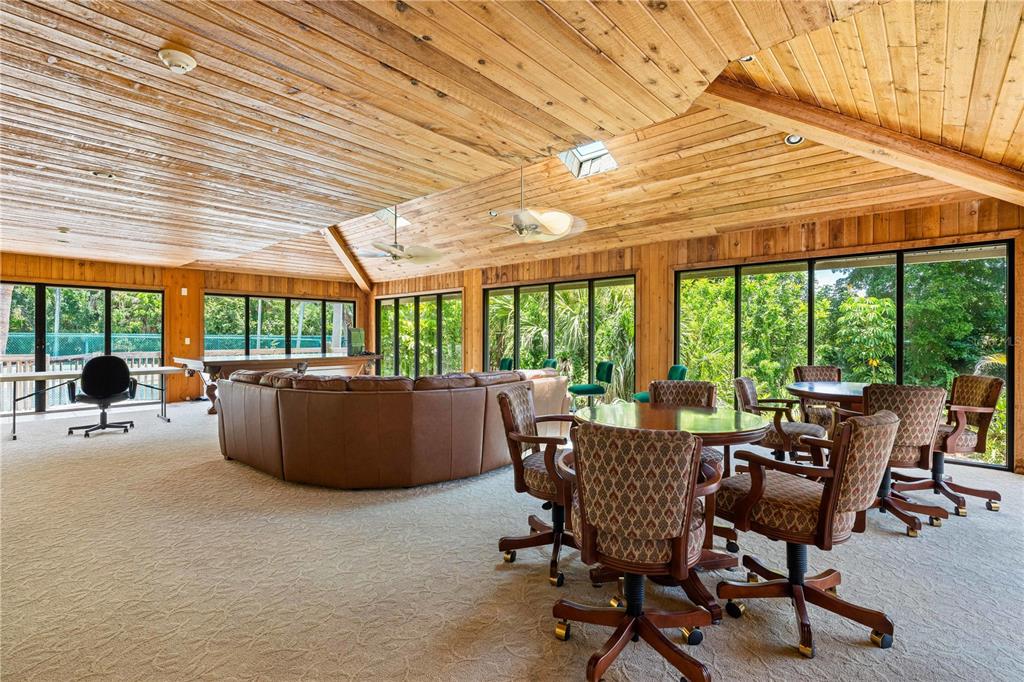 5880 Midnight Pass Road, Unit 302 Sarasota, FL 34242 - Photo 60 of 97 a view of a patio with table and chairs