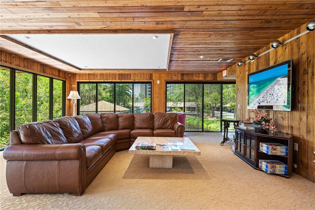 5880 Midnight Pass Road, Unit 302 Sarasota, FL 34242 - Photo 62 of 97 a living room with furniture and a large window