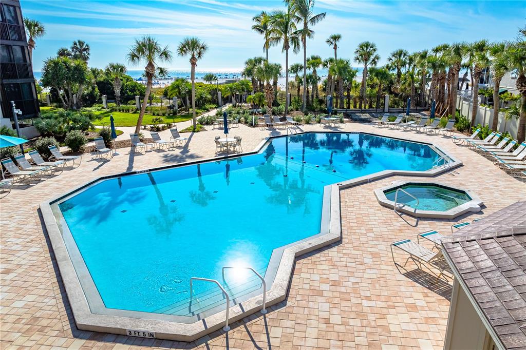 5880 Midnight Pass Road, Unit 302 Sarasota, FL 34242 - Photo 69 of 97 a view of a swimming pool with a patio