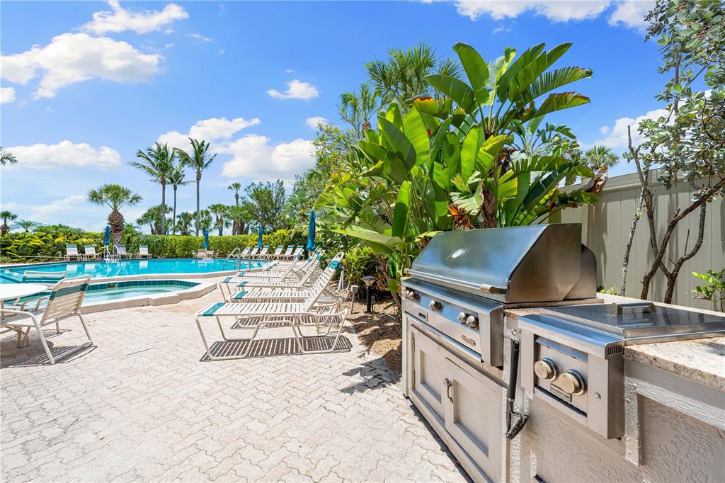 5880 Midnight Pass Road, Unit 302 Sarasota, FL 34242 - Photo 72 of 97 a view of a house with backyard and sitting area