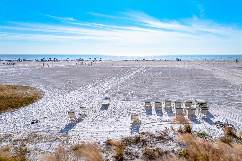 5880 Midnight Pass Road, Unit 302 Sarasota, FL 34242 - Photo 80 of 97 a view of a big yard with a ocean view