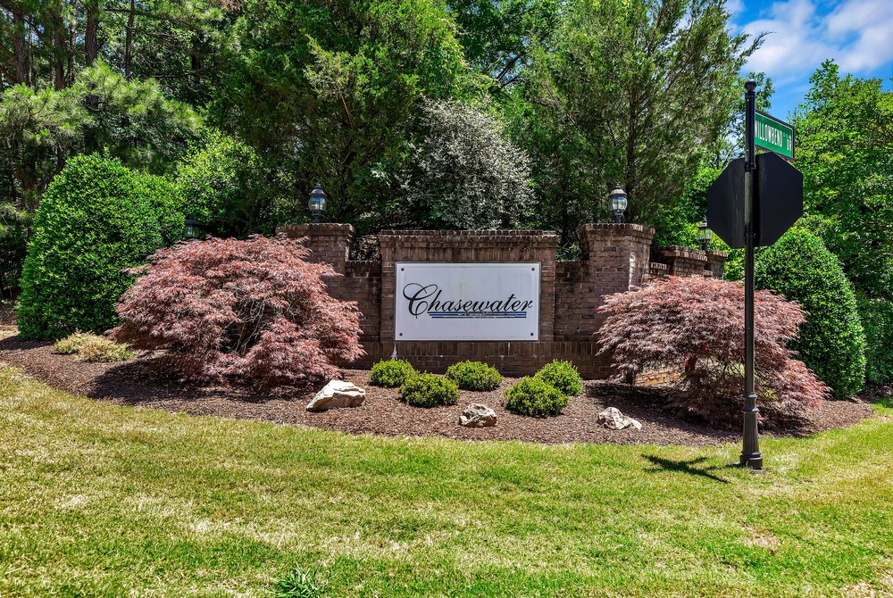 114 Willowbend Drive Anderson, SC 29621 - Photo 49 of 50 Welcome to the community with a charming brick entrance and lush, mature landscaping.