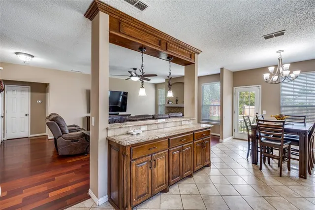 a view of a house with backyard and garden