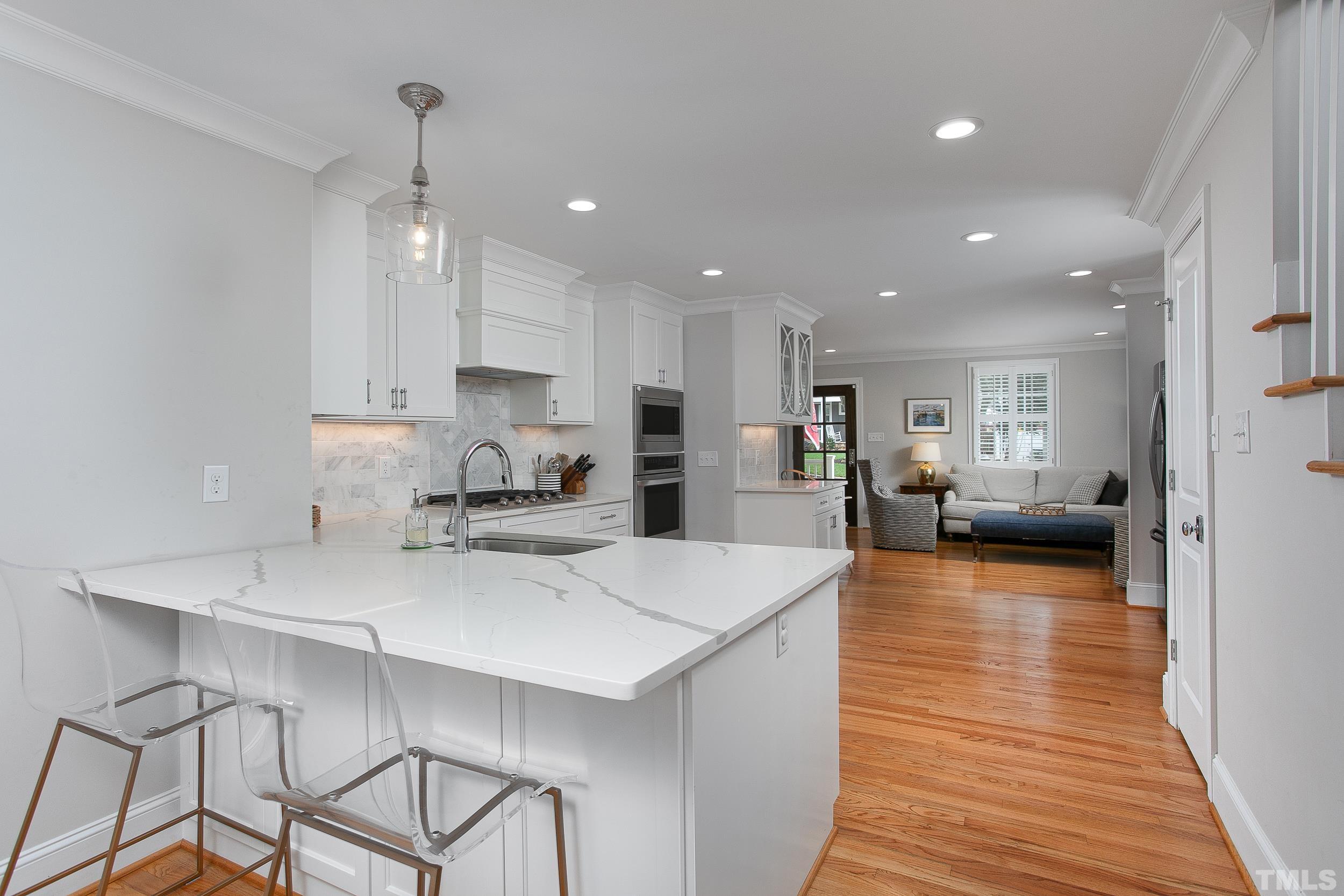 632 New Road Raleigh, NC 27608 - Photo 15 of 35 a view of kitchen with cabinets table and chairs