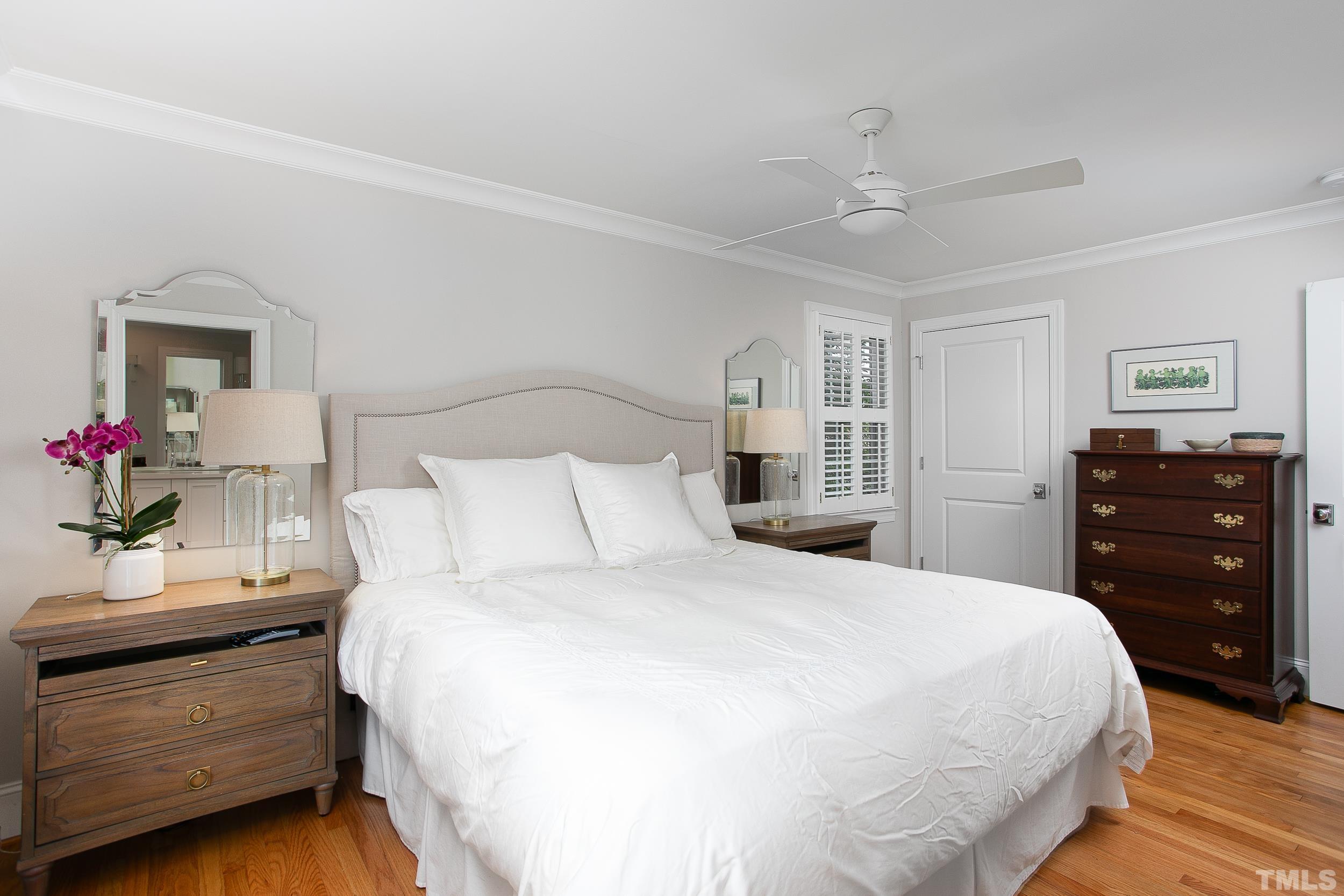 632 New Road Raleigh, NC 27608 - Photo 18 of 35 a bedroom with a bed and a dresser