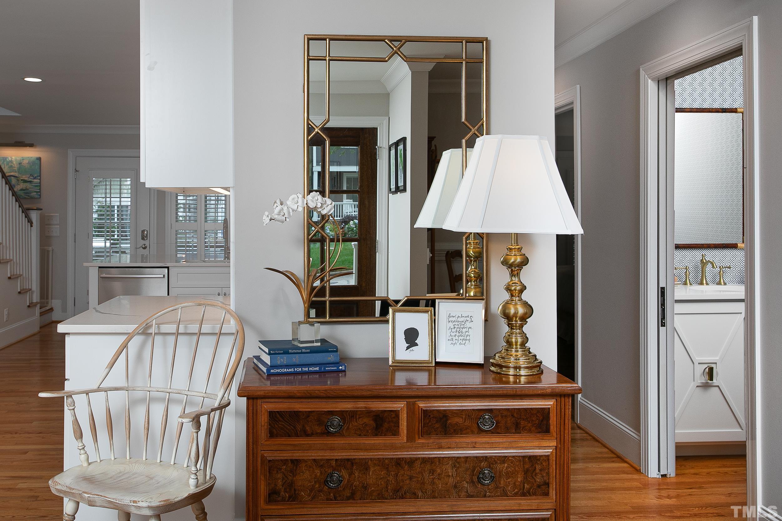 632 New Road Raleigh, NC 27608 - Photo 4 of 35 a living room with a table chairs and a window