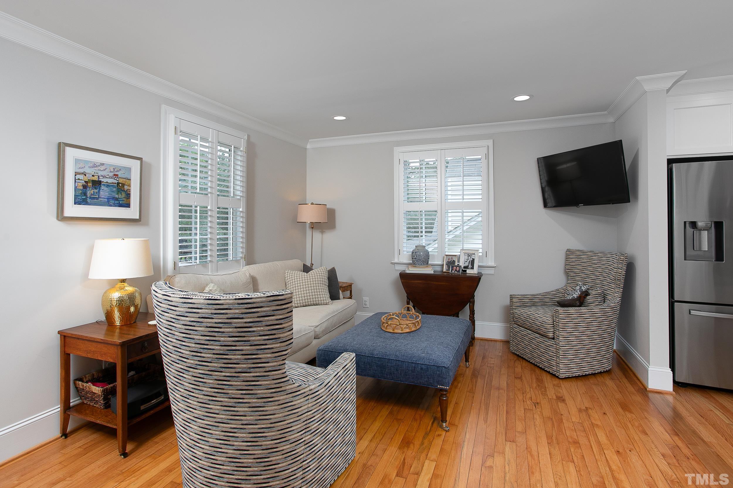 632 New Road Raleigh, NC 27608 - Photo 8 of 35 a living room with furniture and a flat screen tv