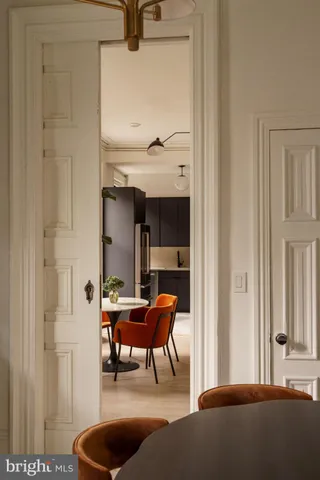 a view of a bedroom with furniture and window