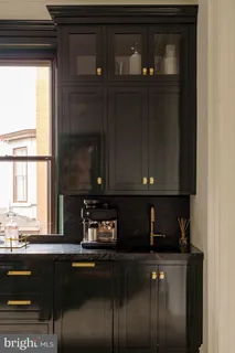 a kitchen with a refrigerator and a window