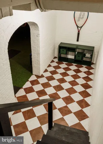 a bedroom with a bed and a mirror