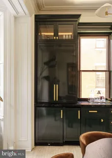 a living room with a couch and a window