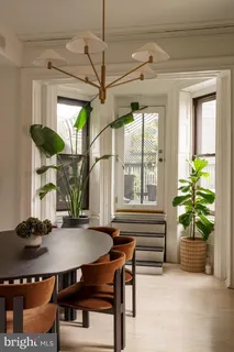 a balcony with table and chairs