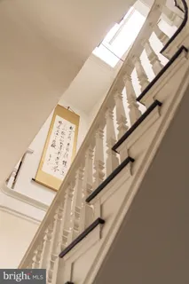 a spacious bedroom with a bed and a dresser