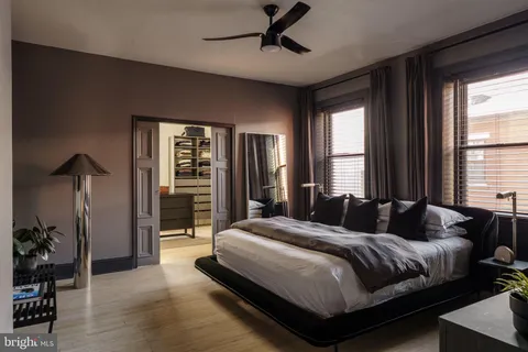 a bathroom with a sink a mirror and a window