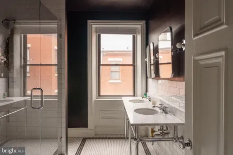 a view of a living room with a fireplace and a window