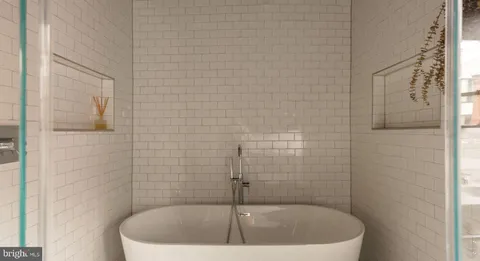 a view of a living room with a fireplace and a window