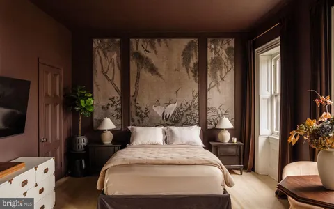 a view of living room with furniture and a large window