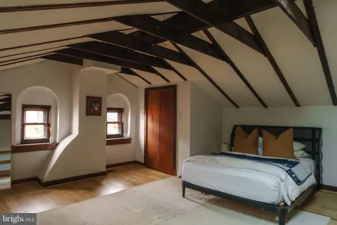 a living room with a black white checkered floor with a black white checkered floor