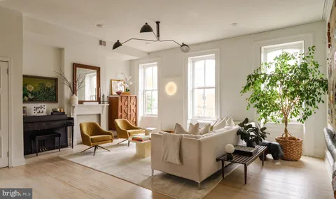 a living room with furniture and a window