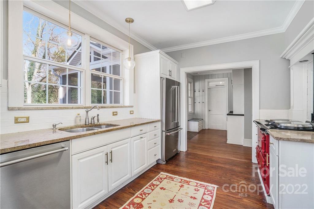 1520 Paddock Circle Charlotte, NC 28209 - Photo 16 of 39 a spacious bathroom with a granite countertop sink and a mirror
